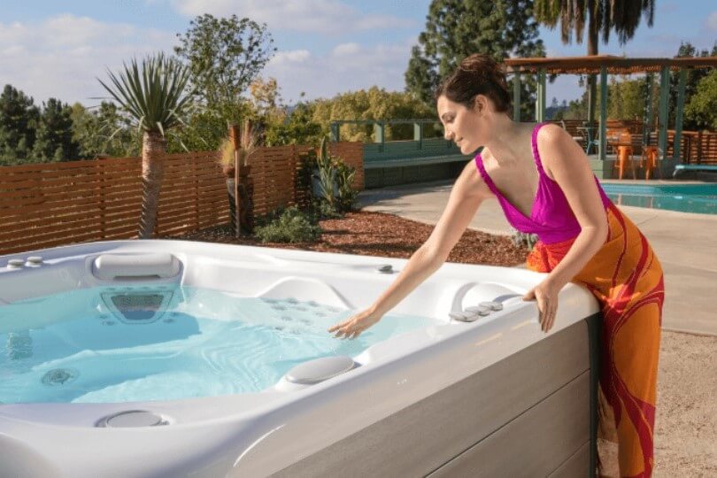 woman next to hot tub